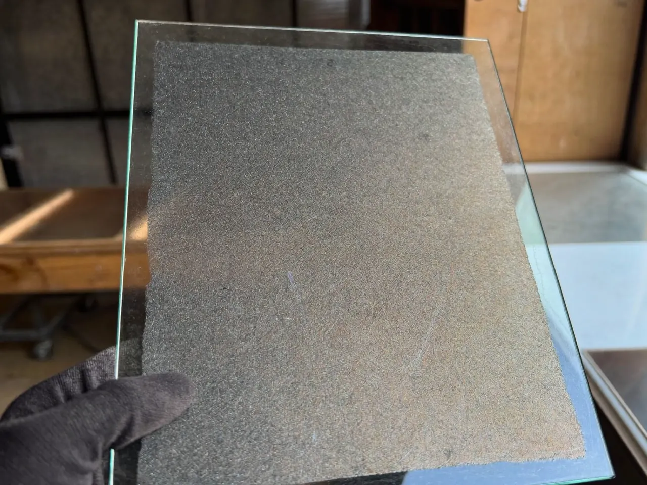 Detail of a low-emissivity coated glass pane catching the light
