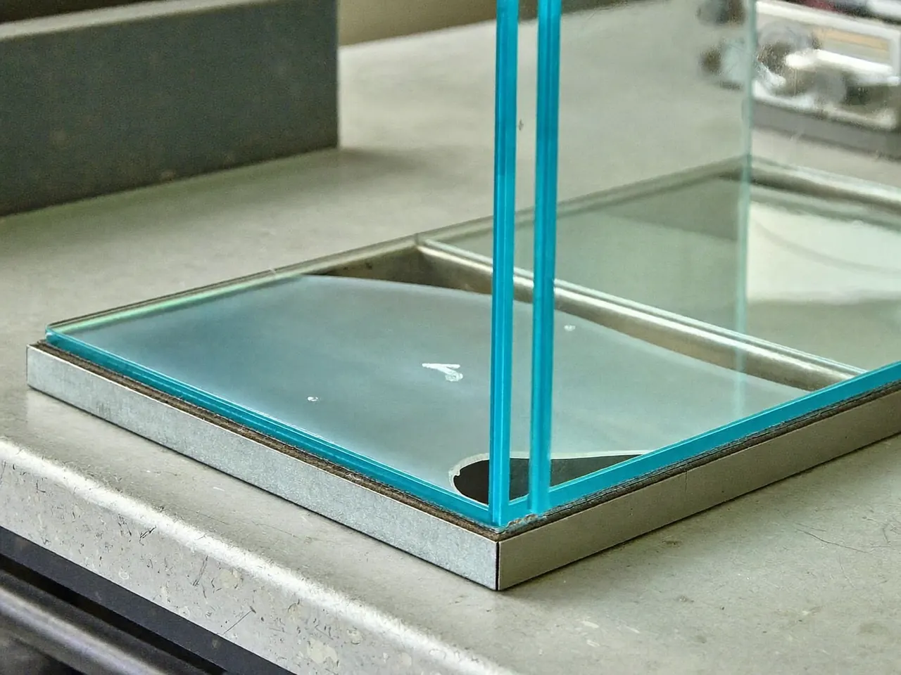 Cutaway of a sealed glazing unit showing the gas-filled cavity and spacer bar