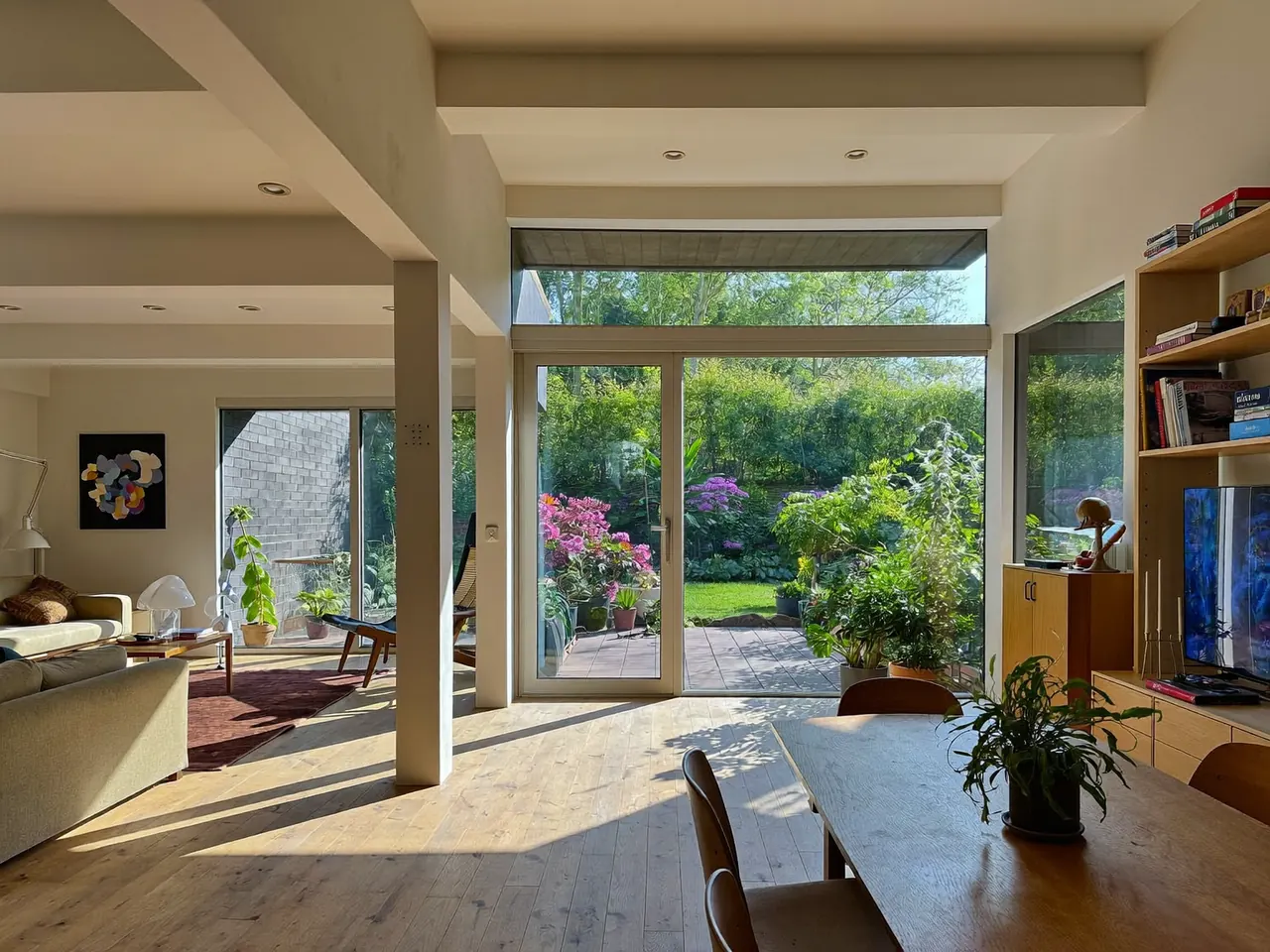 Sunlit room with large glazed windows letting in winter sun